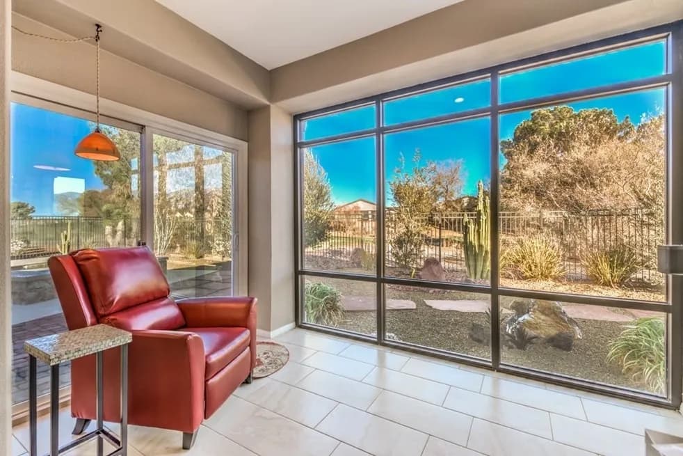 Sunroom overlooking scenic desert landscape and courtyard